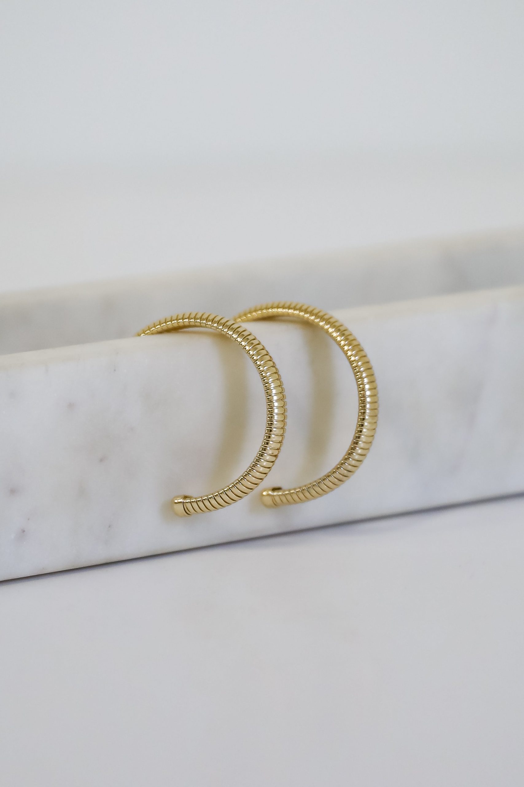 shopdressup_gold_textured_hoop_earrings-4_32be1fd5-fe4d-449c-b5d0-7dc70f74bb34.jpg